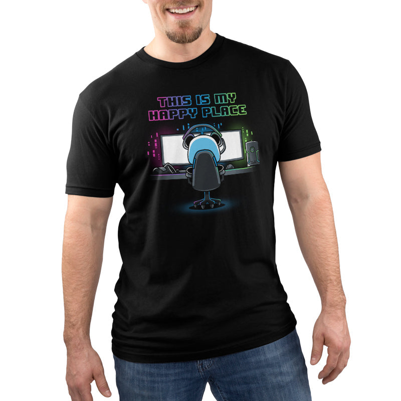 Premium Cotton T-shirt_Illustration of a person sitting at a computer desk with multiple monitors, wearing a headset and a black apparel. Above them, text reads "My Rig is My Happy Place" by monsterdigital in colorful neon letters.